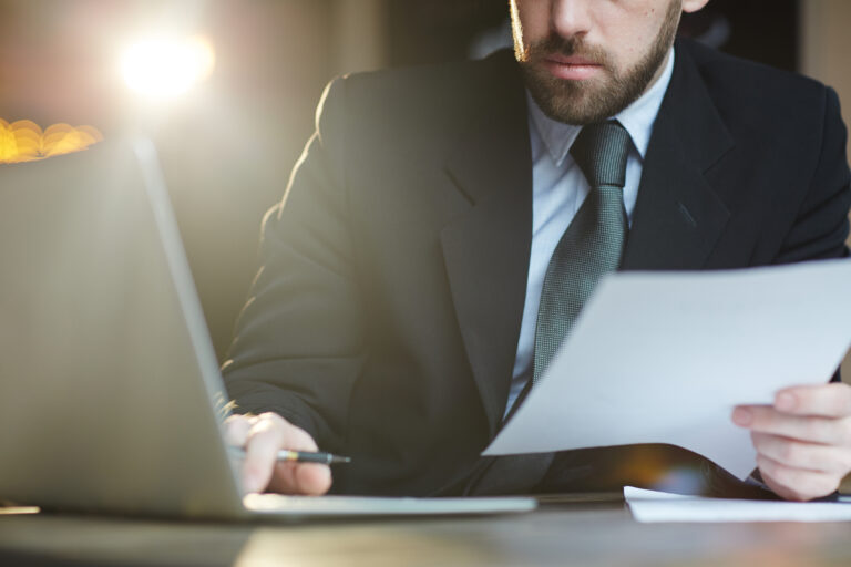 Bearded Businessman Working with Documents in Office